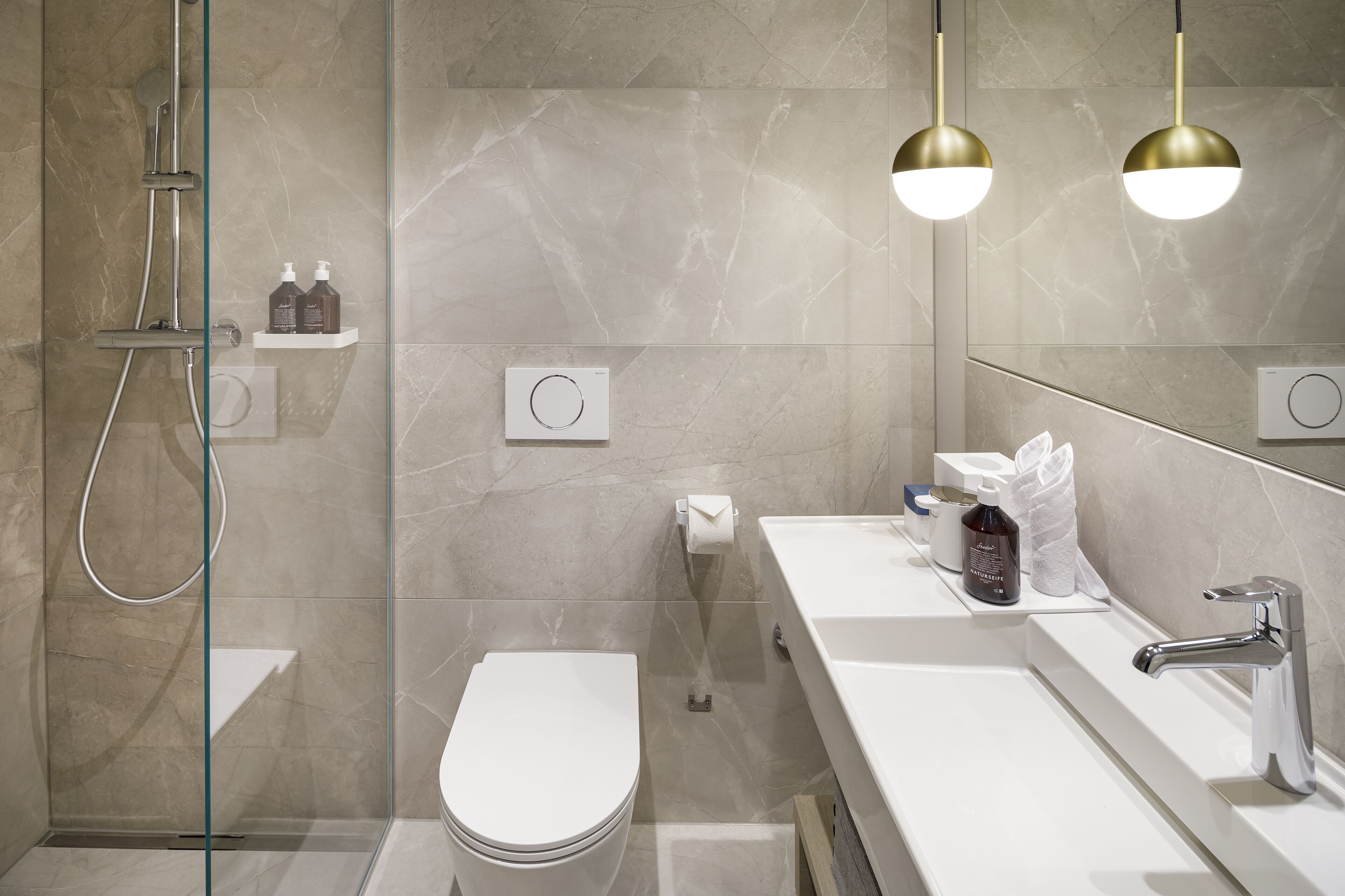 eco-friendly toiletries, hair dryer, towels