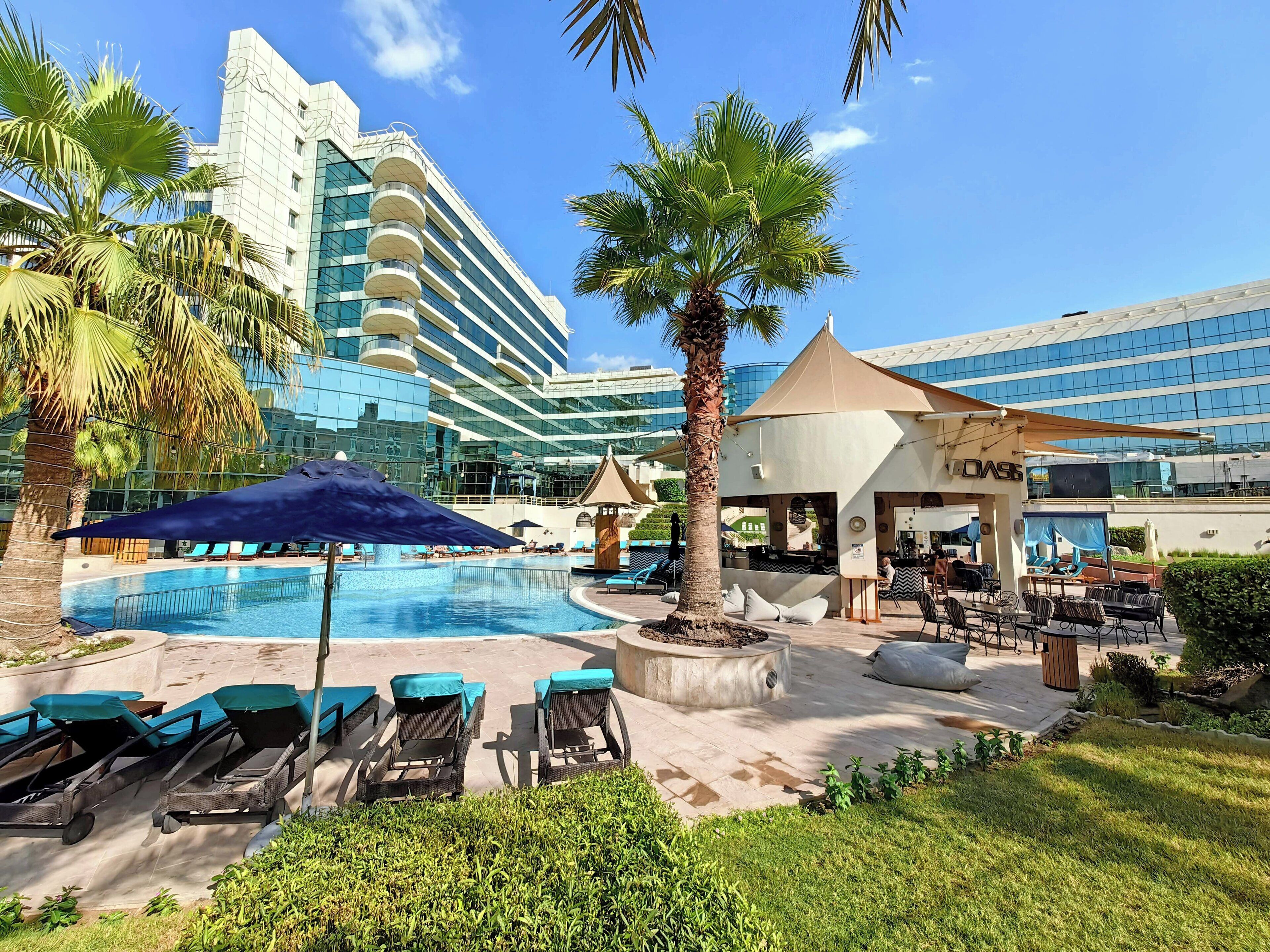 Outdoor pool, pool umbrellas, sun loungers