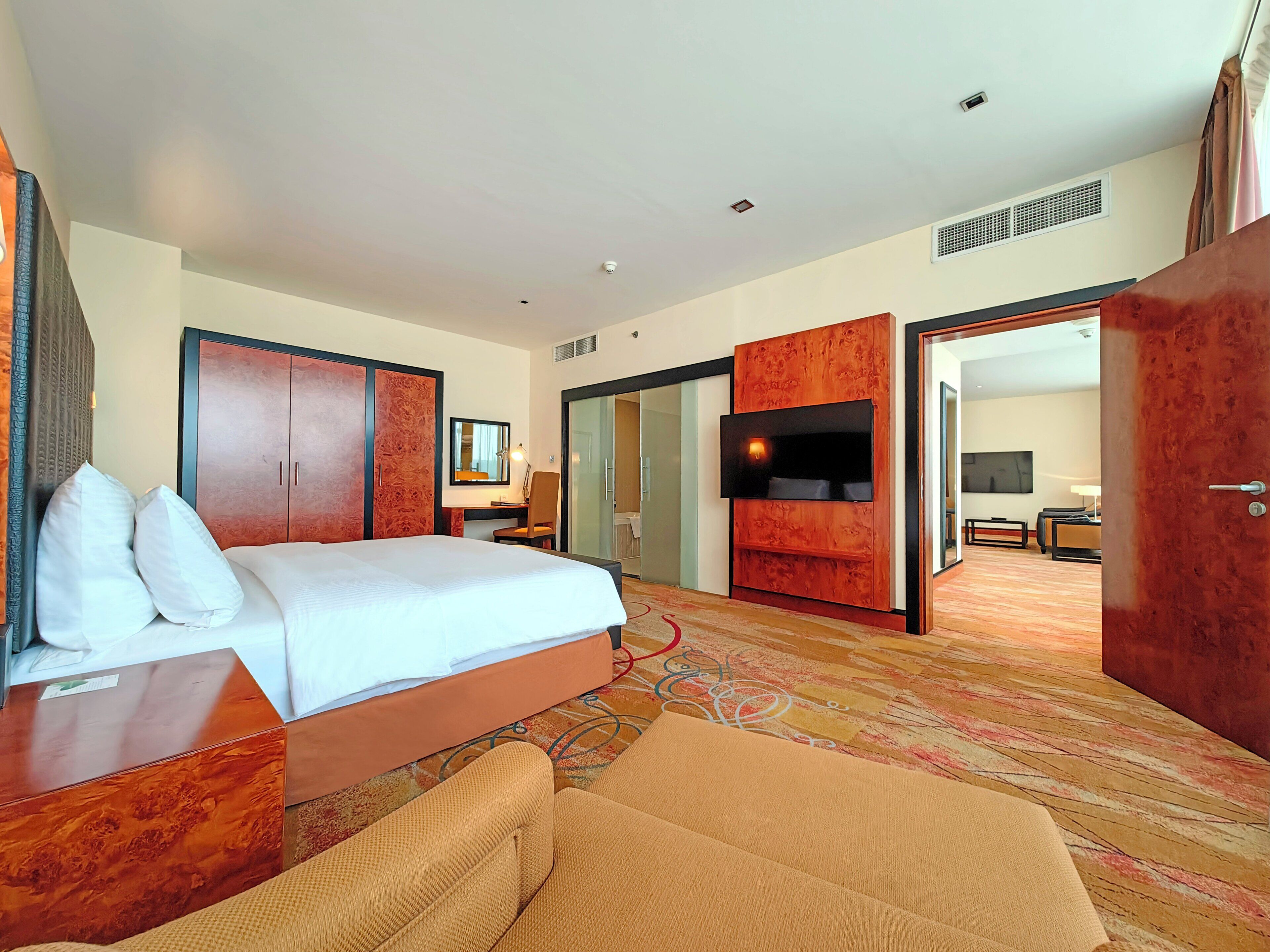 Executive Deluxe Suite, complimentary shuttle to DXB Airport Terminal 1 & 3 | Minibar, in-room safe, laptop workspace, soundproofing