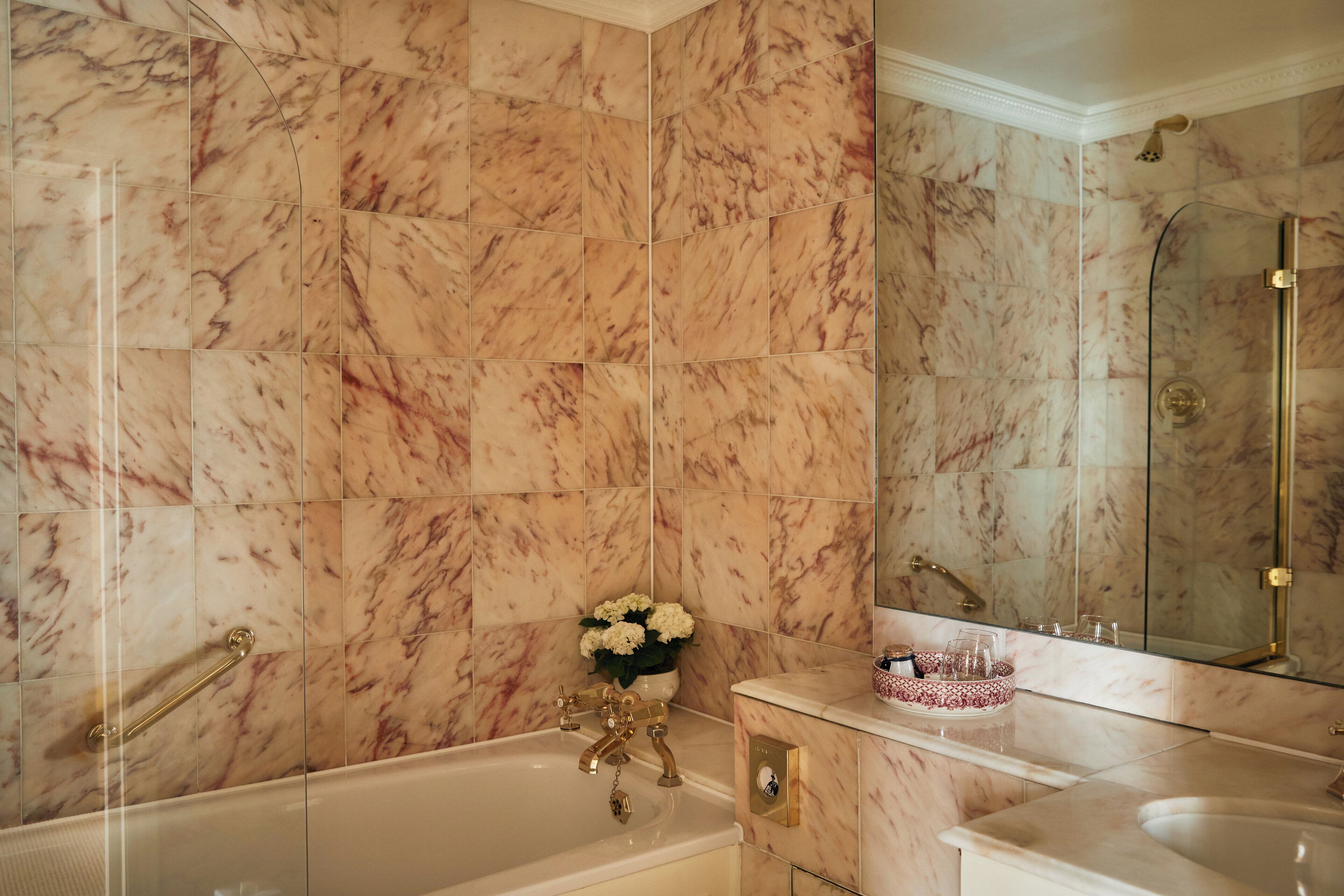 deluxe room, 1 queen bed | bathroom | combined shower/bathtub, designer toiletries, hair dryer, bathrobes