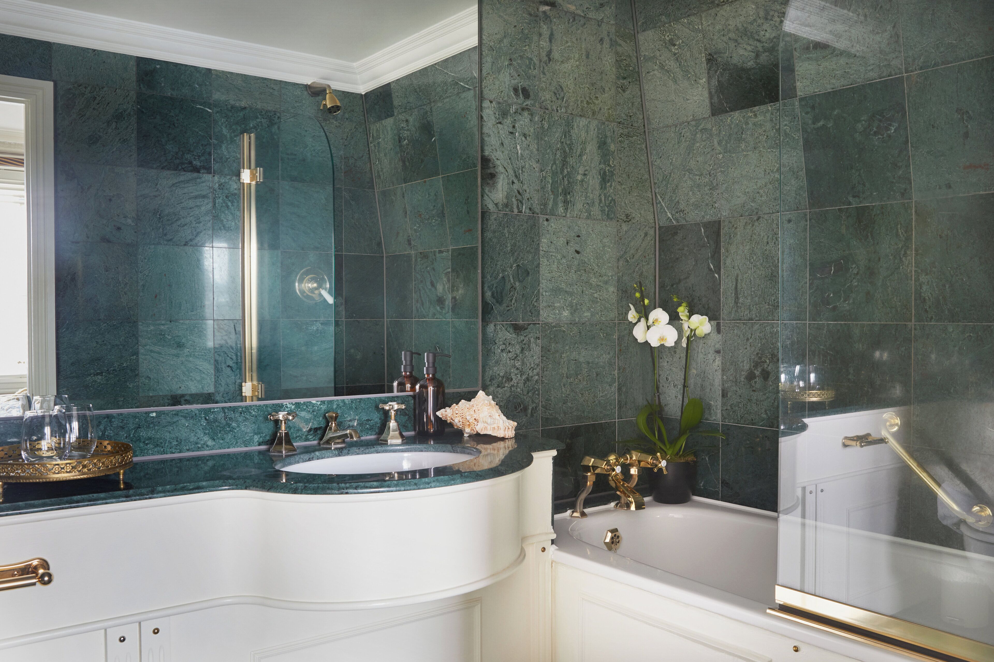 combined shower/bathtub, designer toiletries, hair dryer, bathrobes