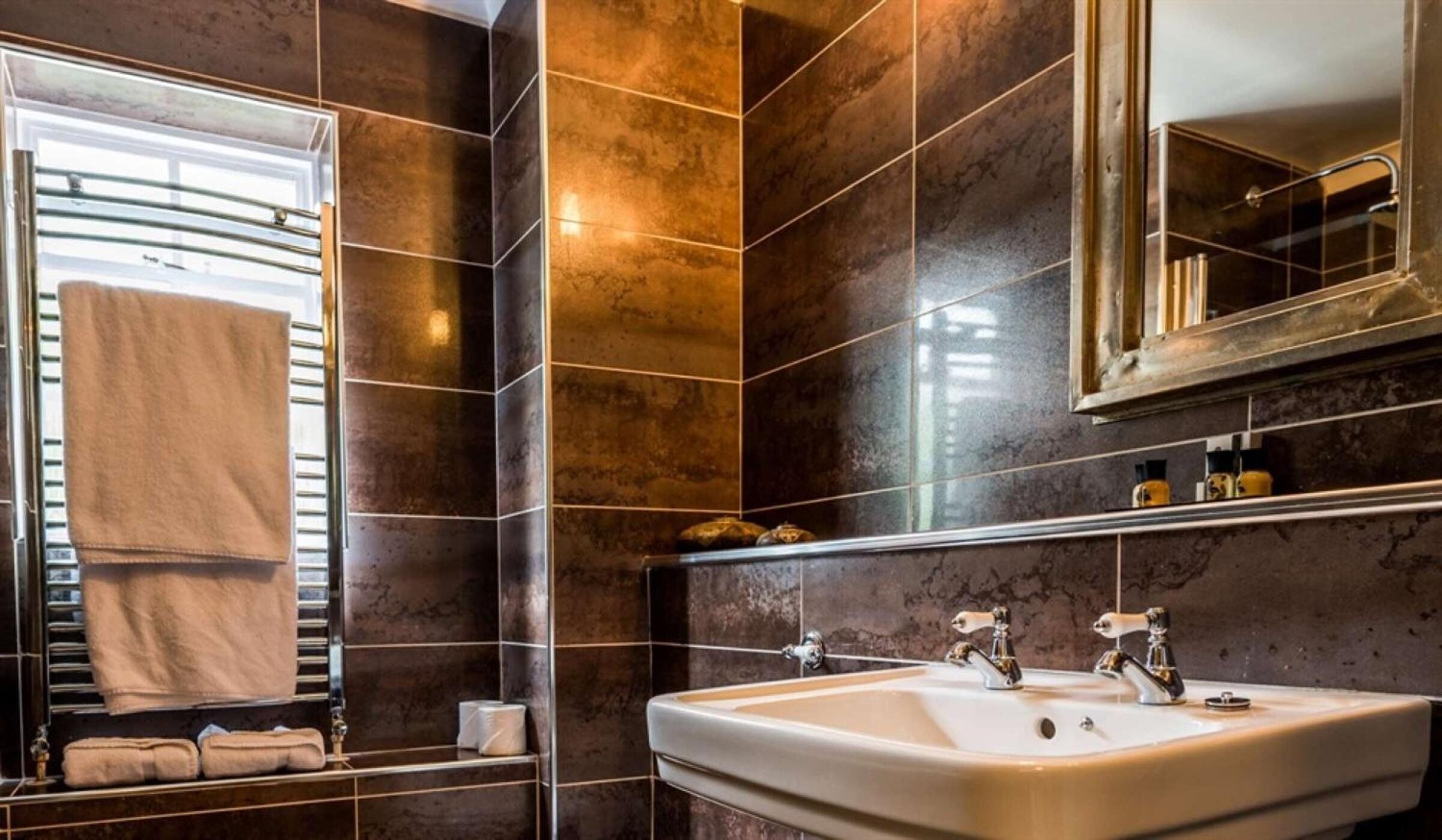 chic double room | bathroom | hair dryer, towels, toilet paper