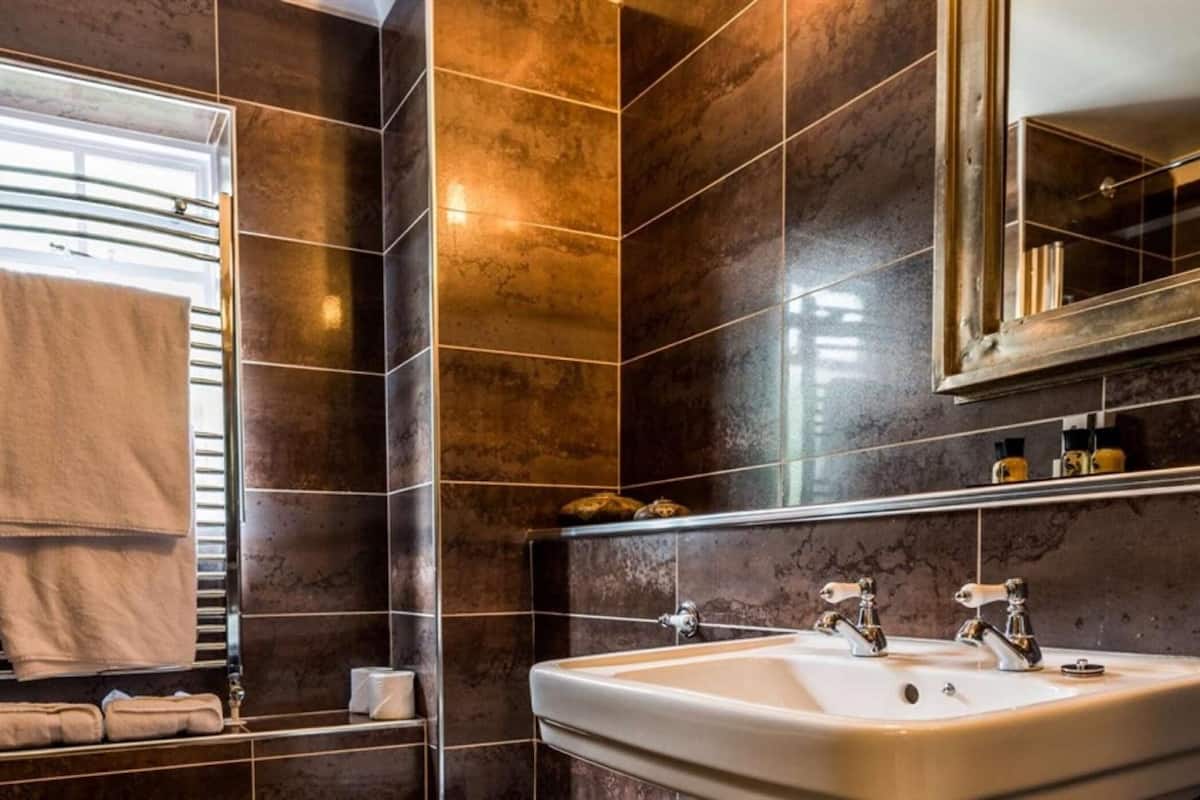 chic double room | bathroom | hair dryer, towels, toilet paper