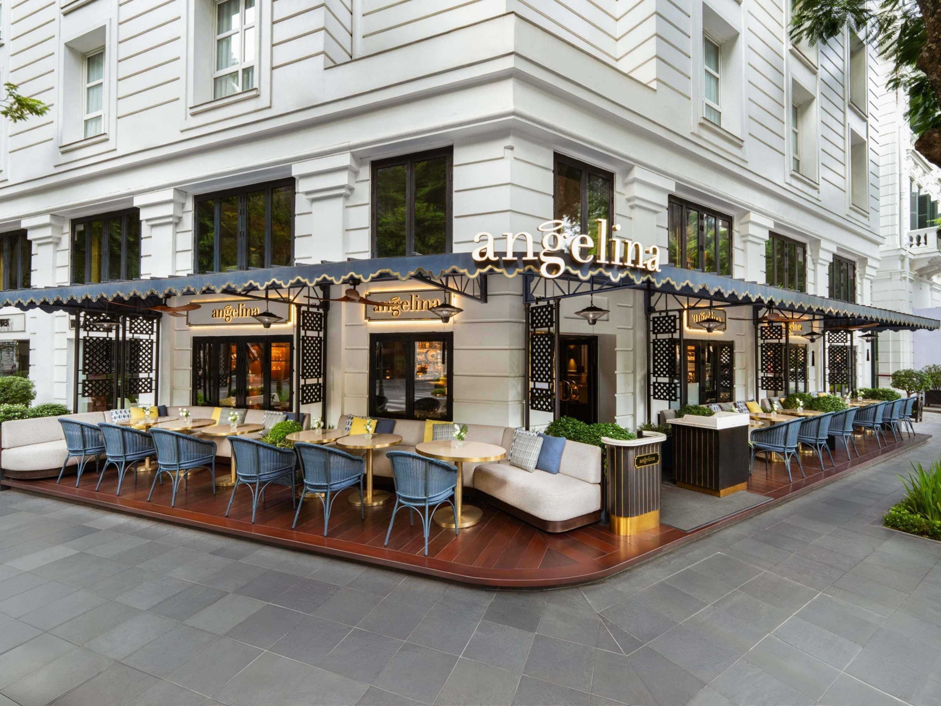 An exterior of a restaurant with outdoor seating, a covered patio area, and a sign reading 'angelina'.
