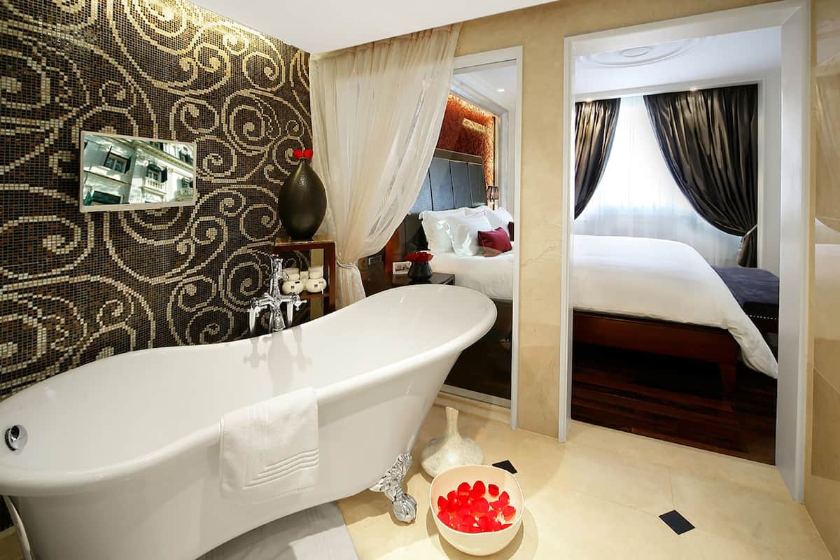 opera wing, prestige suite with club privileges and benefits, king bed | bathroom | designer toiletries, hair dryer, bathrobes, slippers
