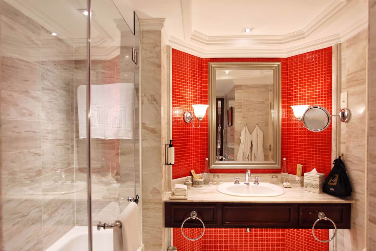 designer toiletries, hair dryer, bathrobes, slippers