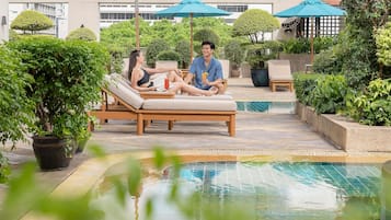 Outdoor pool, open 7:00 AM to 9:00 PM, pool umbrellas, pool loungers