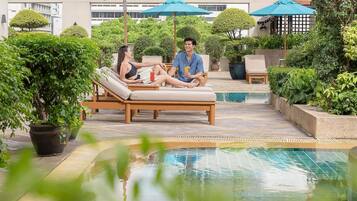 Outdoor pool, open 7:00 AM to 9:00 PM, pool umbrellas, pool loungers