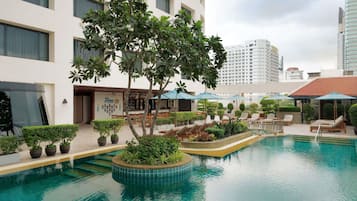 Outdoor pool, open 7:00 AM to 9:00 PM, pool umbrellas, pool loungers