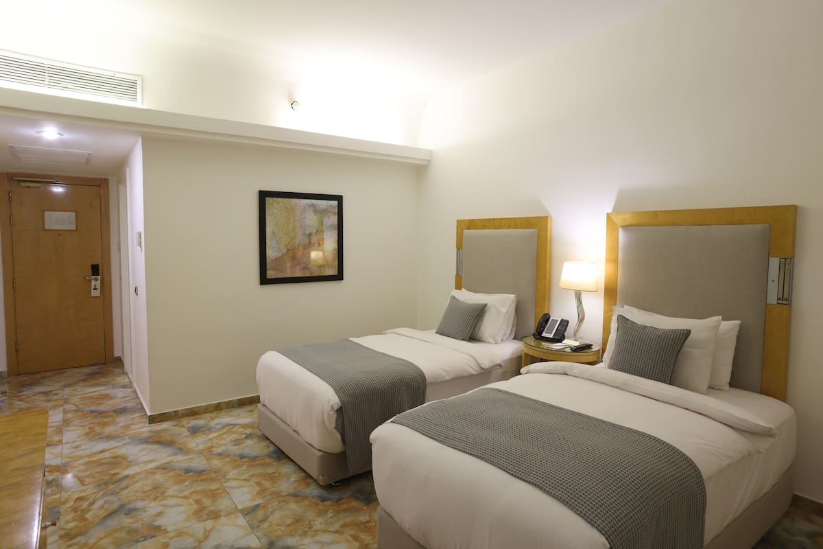 Quarto clássico, vista para a cidade | 1 quarto, roupas de cama premium, frigobar, cofres nos quartos