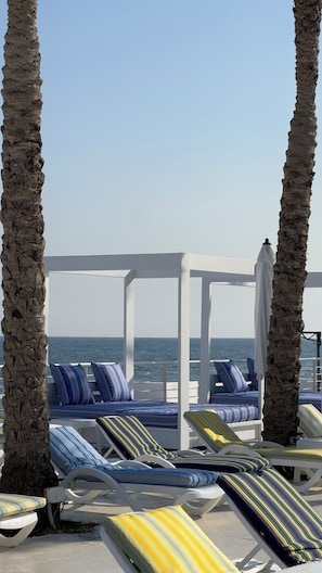 Seasonal outdoor pool, open 9:00 AM to 6:00 PM, pool umbrellas