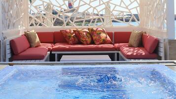 Seasonal outdoor pool, open 9:00 AM to 6:00 PM, pool umbrellas