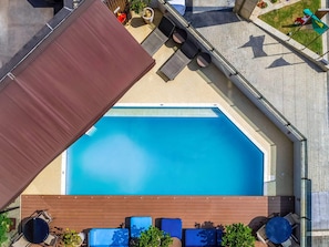 Outdoor pool, open 8:00 AM to 10:00 PM, pool loungers