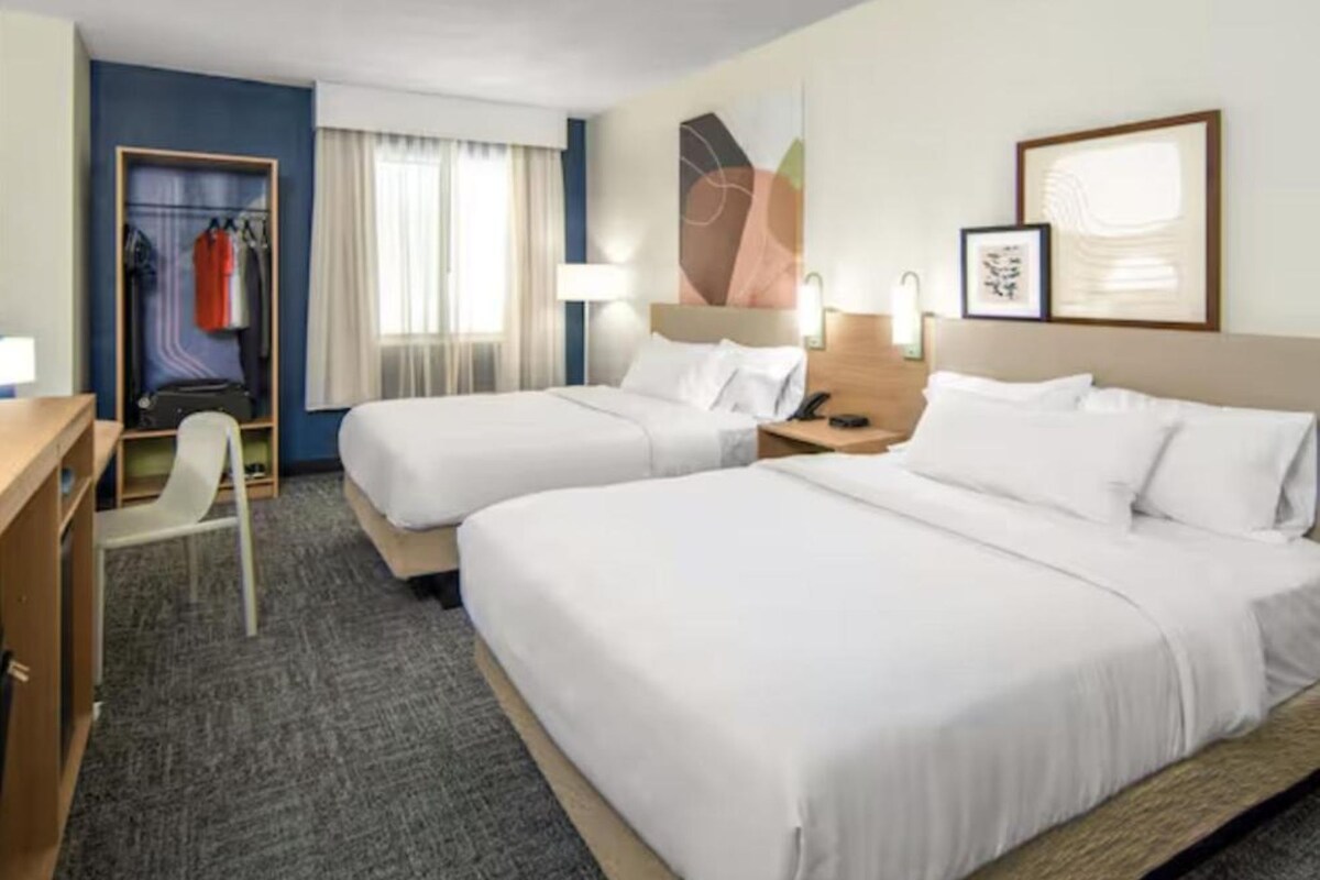 Premium bedding, down comforters, desk, blackout drapes