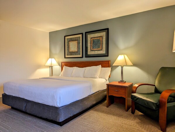 Habitación Deluxe, 1 cama King size | Ropa de cama de alta calidad y escritorio 