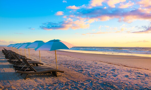 On the beach, sun-loungers, beach umbrellas, beach towels