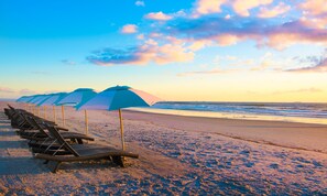 On the beach, sun loungers, beach umbrellas, beach towels