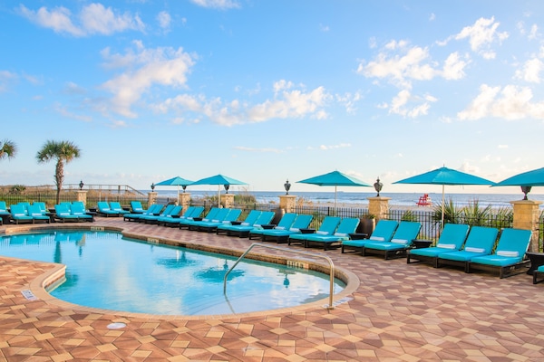 Outdoor pool, open 7:00 AM to 7:00 PM, pool umbrellas, pool loungers