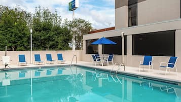 Seasonal outdoor pool, pool umbrellas, pool loungers