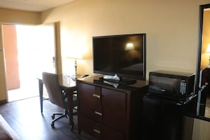 Premium bedding, desk, laptop workspace, blackout drapes