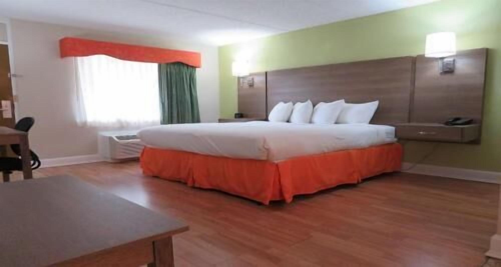 Premium bedding, desk, laptop workspace, iron/ironing board