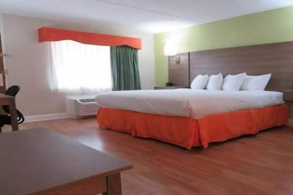 Premium bedding, desk, laptop workspace, iron/ironing board