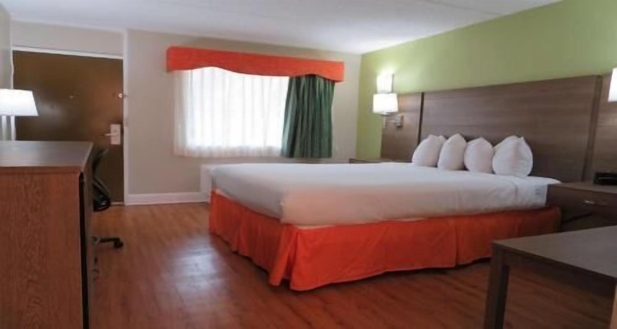 Premium bedding, desk, laptop workspace, iron/ironing board