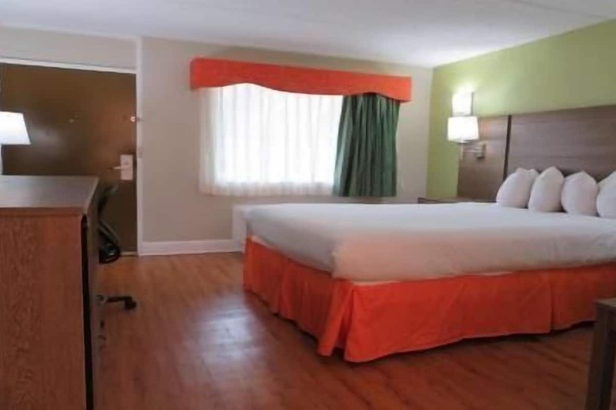 Premium bedding, desk, laptop workspace, iron/ironing board