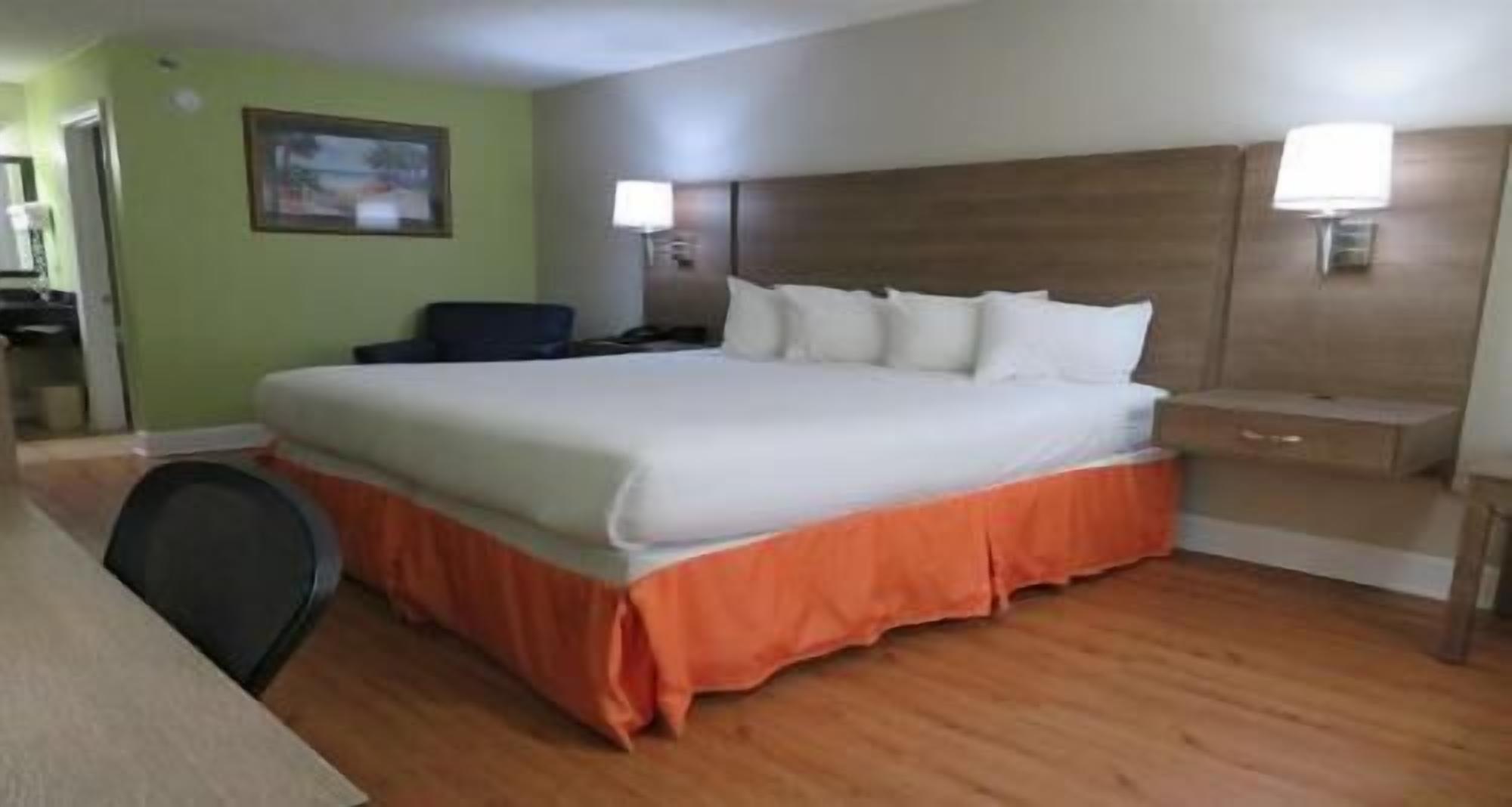 Premium bedding, desk, laptop workspace, iron/ironing board