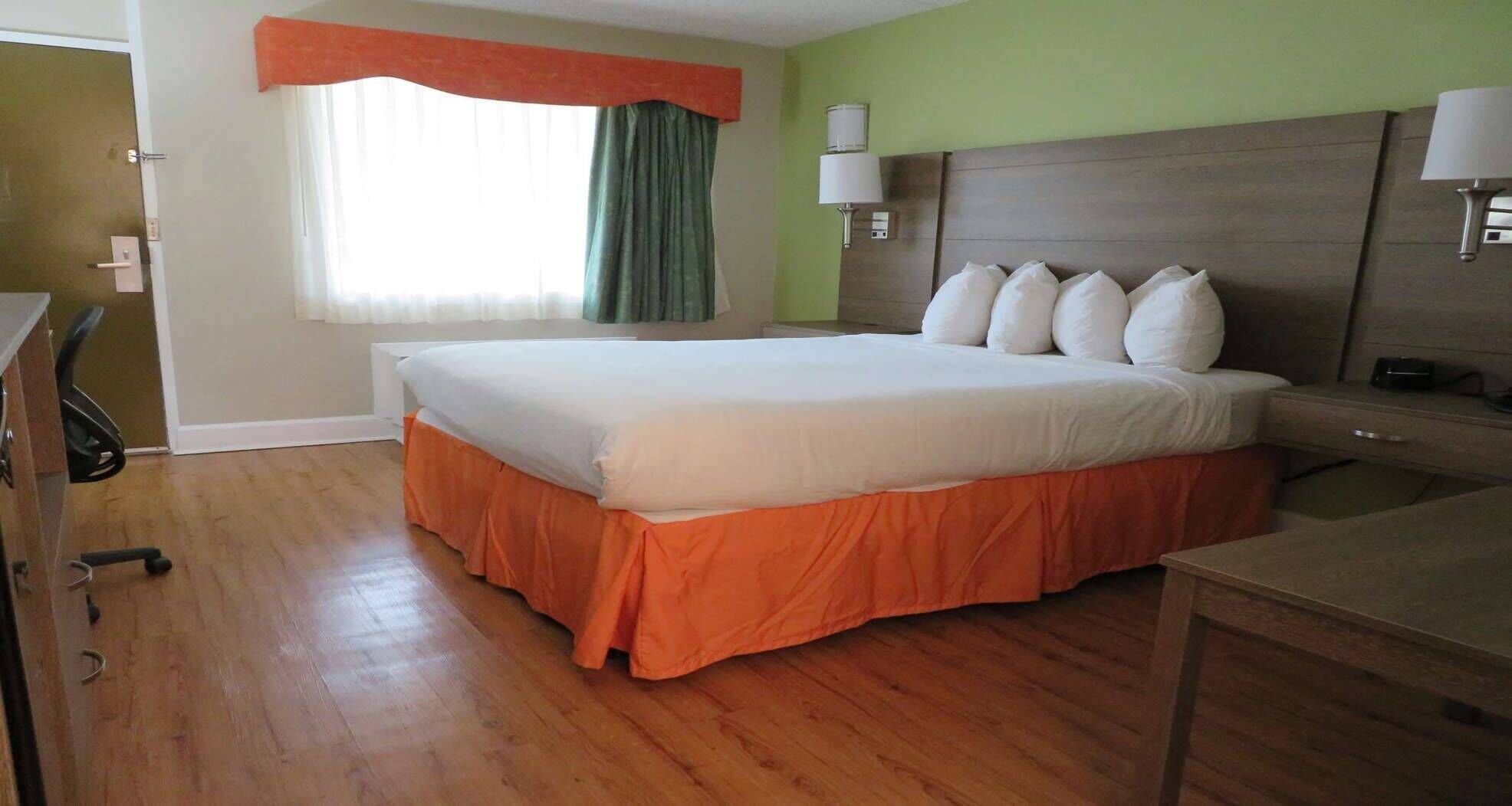 Premium bedding, desk, laptop workspace, iron/ironing board