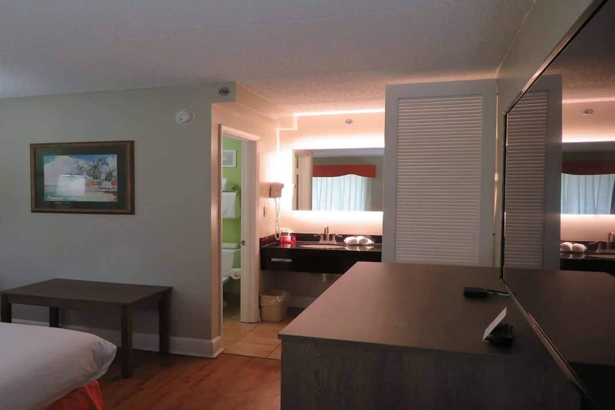 Premium bedding, desk, laptop workspace, iron/ironing board