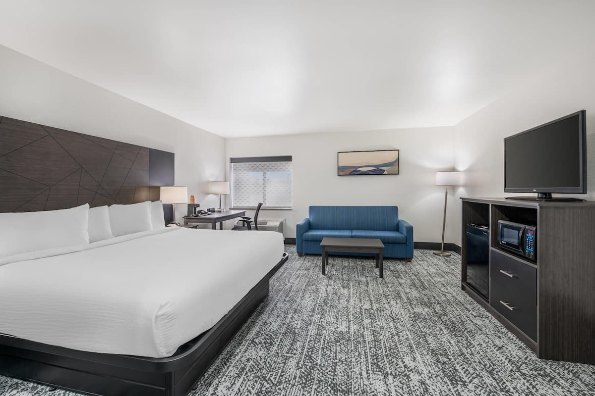 Suite, 1 King Bed, Non Smoking | Pillowtop beds, desk, iron/ironing board, free cribs/infant beds