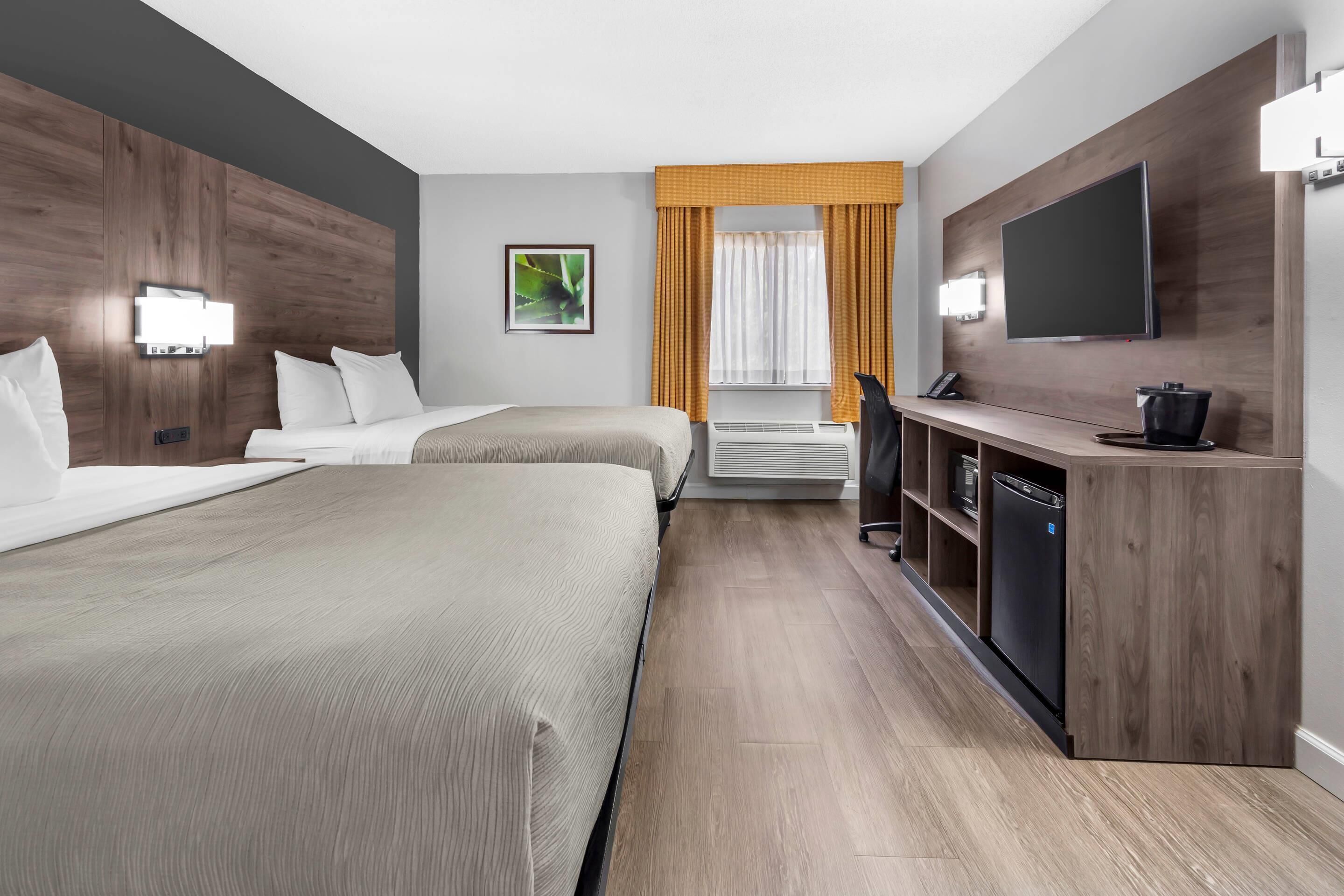 room, 2 queen beds, non smoking | premium bedding, desk, iron/ironing board, free cots/infant beds