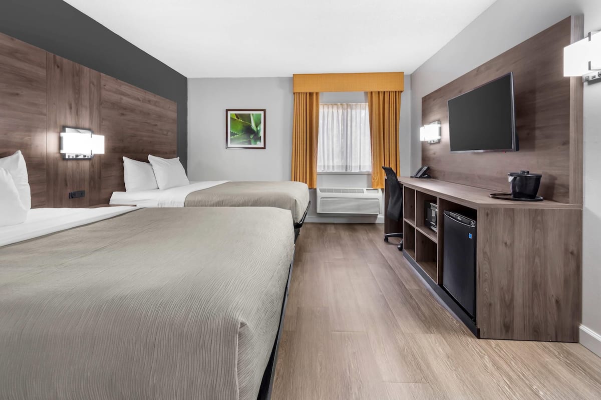 room, 2 queen beds, non smoking | premium bedding, desk, iron/ironing board, free cots/infant beds