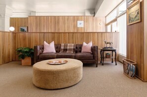 Relax in style with plush seating and elegant decor.