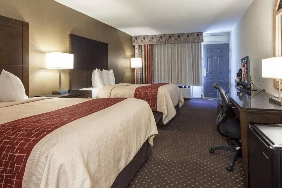 Desk, laptop workspace, blackout drapes, iron/ironing board