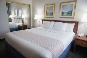 Suite, 1 King Bed, Non Smoking | Pillowtop beds, desk, blackout drapes, iron/ironing board