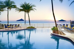 Outdoor pool, pool umbrellas, sun loungers