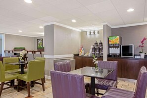 Enjoy meals in a comfortable dining area with a self-service beverage station and ample seating for individual and group dining.