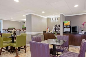 Enjoy meals in a comfortable dining area with a self-service beverage station and ample seating for individual and group dining.