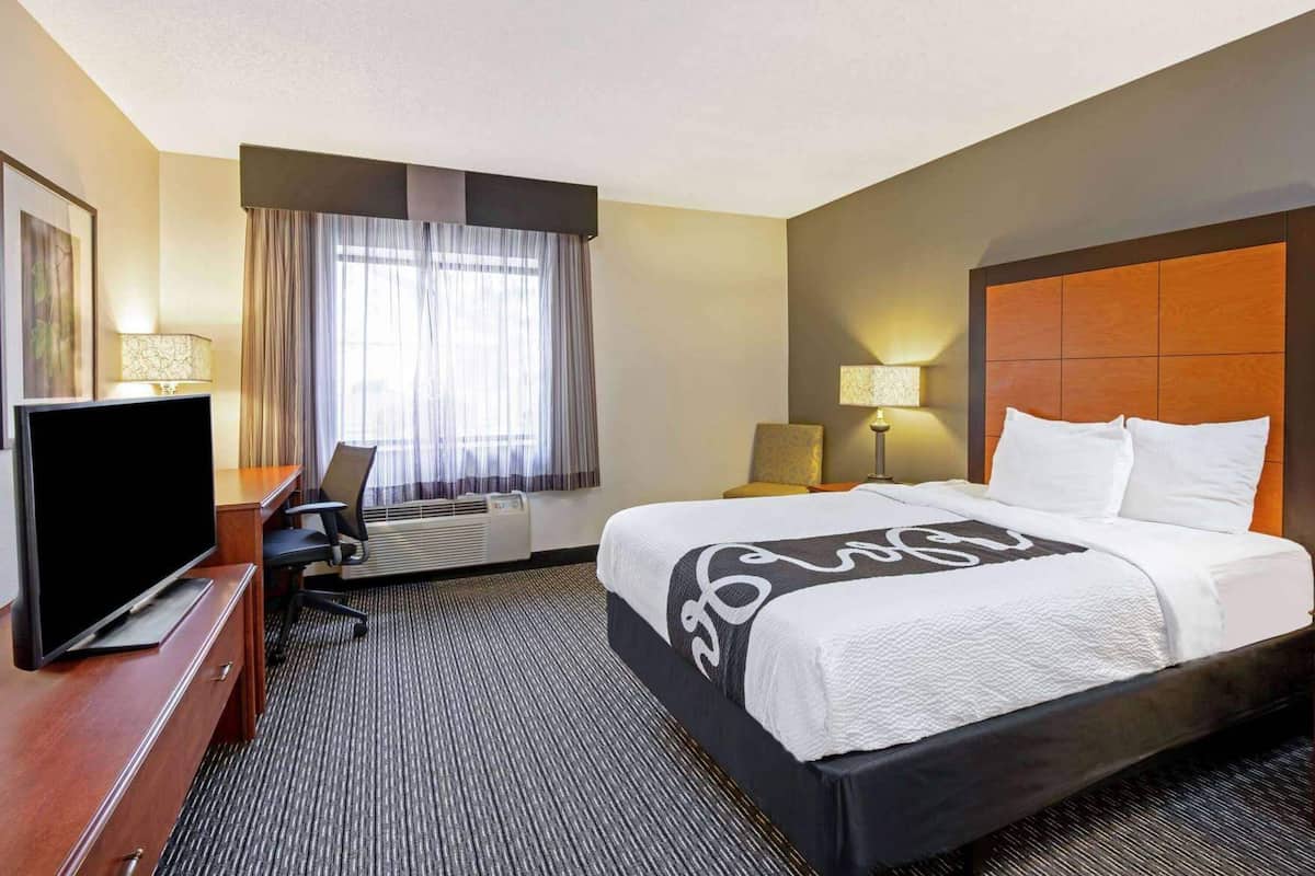 Premium bedding, blackout curtains, iron/ironing board