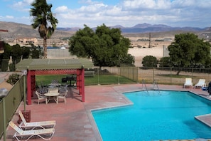 Outdoor pool, open 7:00 AM to 10:00 PM, sun loungers