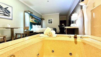 Deluxe Room, 1 King Bed, In-Room Jetted Tub, Non Smoking | In-room safe, desk, laptop workspace, blackout drapes