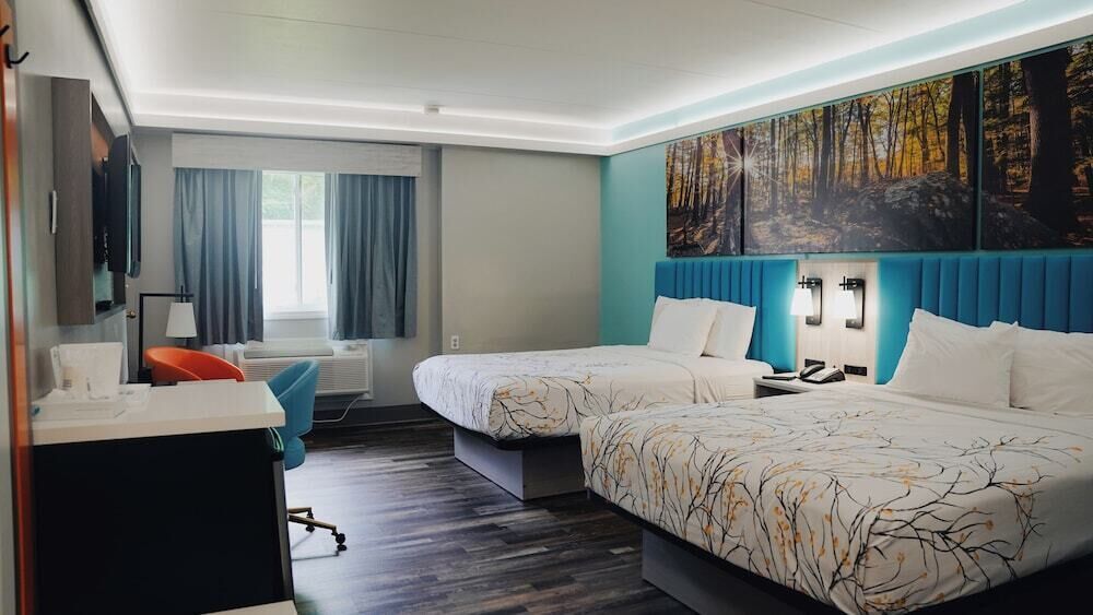 Pillowtop beds, desk, blackout drapes, iron/ironing board