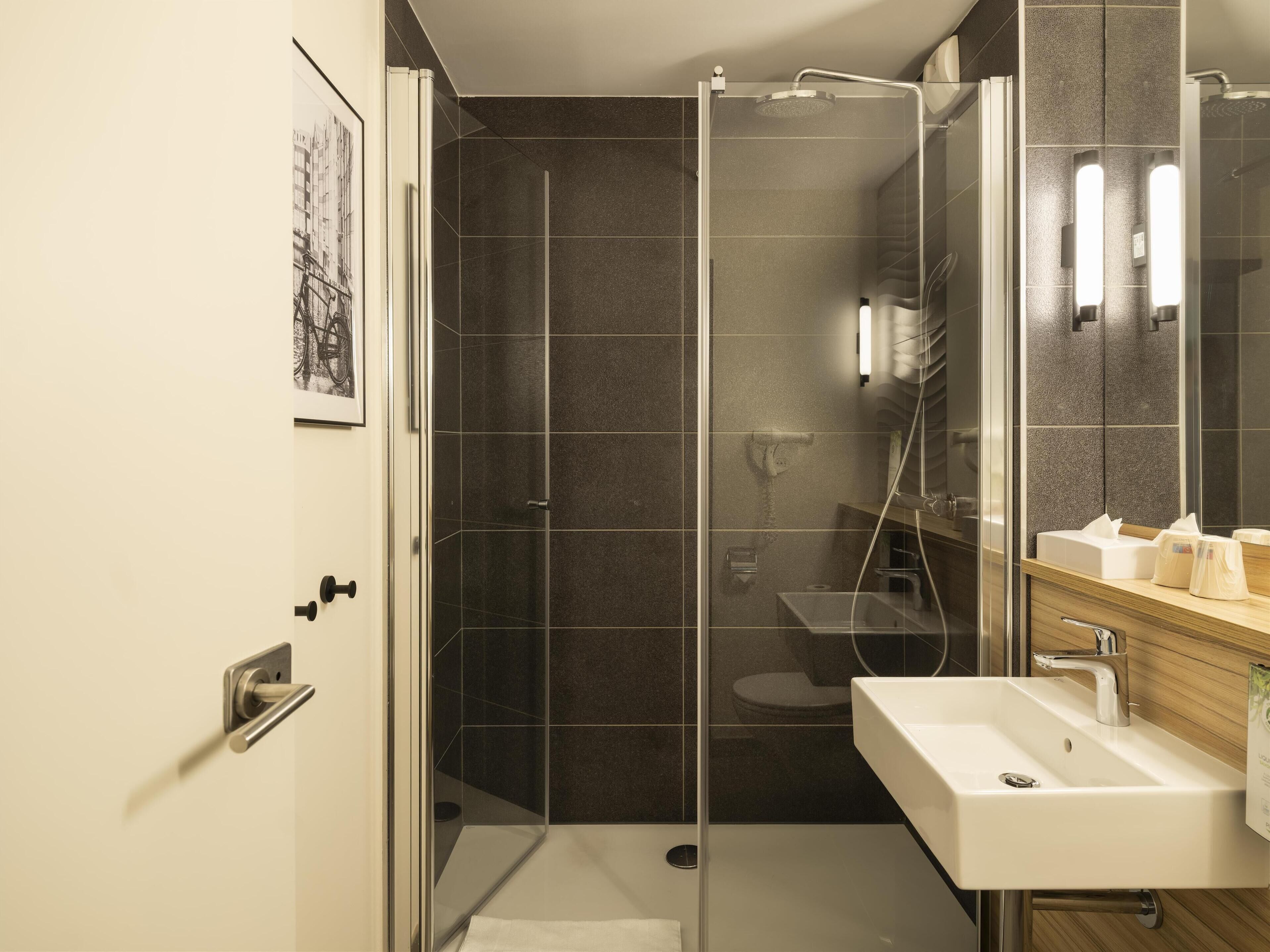 superior room, 1 king bed | bathroom | eco-friendly toiletries, hair dryer, towels