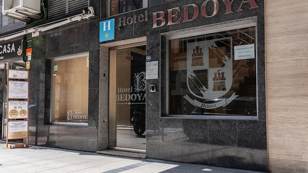 Hotel BEDOYA with a modern facade, large windows, and a prominent logo. - Hotel Bedoya (Santander)