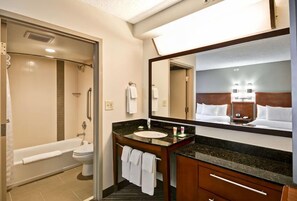 Combined shower/bathtub, designer toiletries, hair dryer, towels