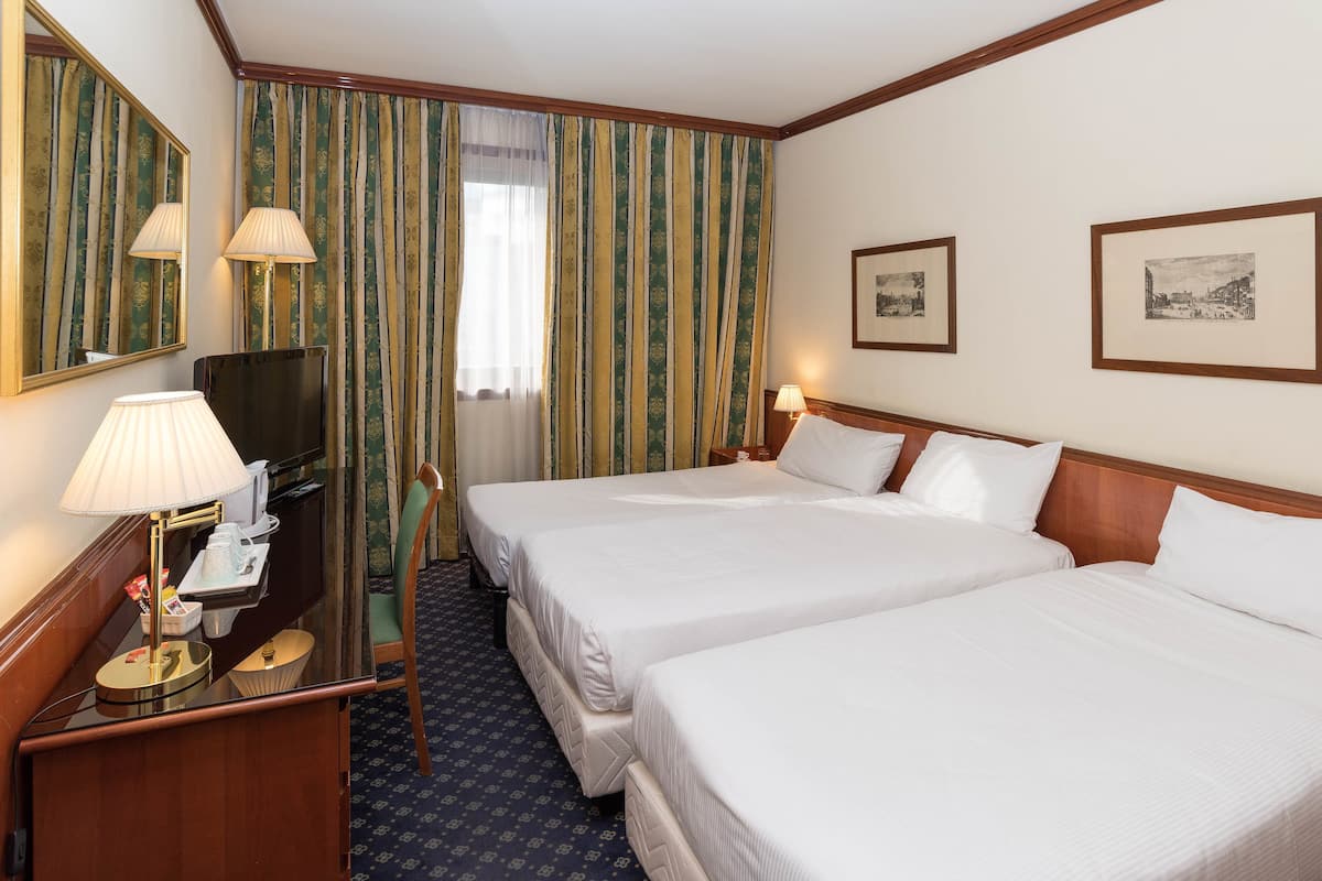 Classic Triple Room | Down duvets, minibar, in-room safe, individually furnished