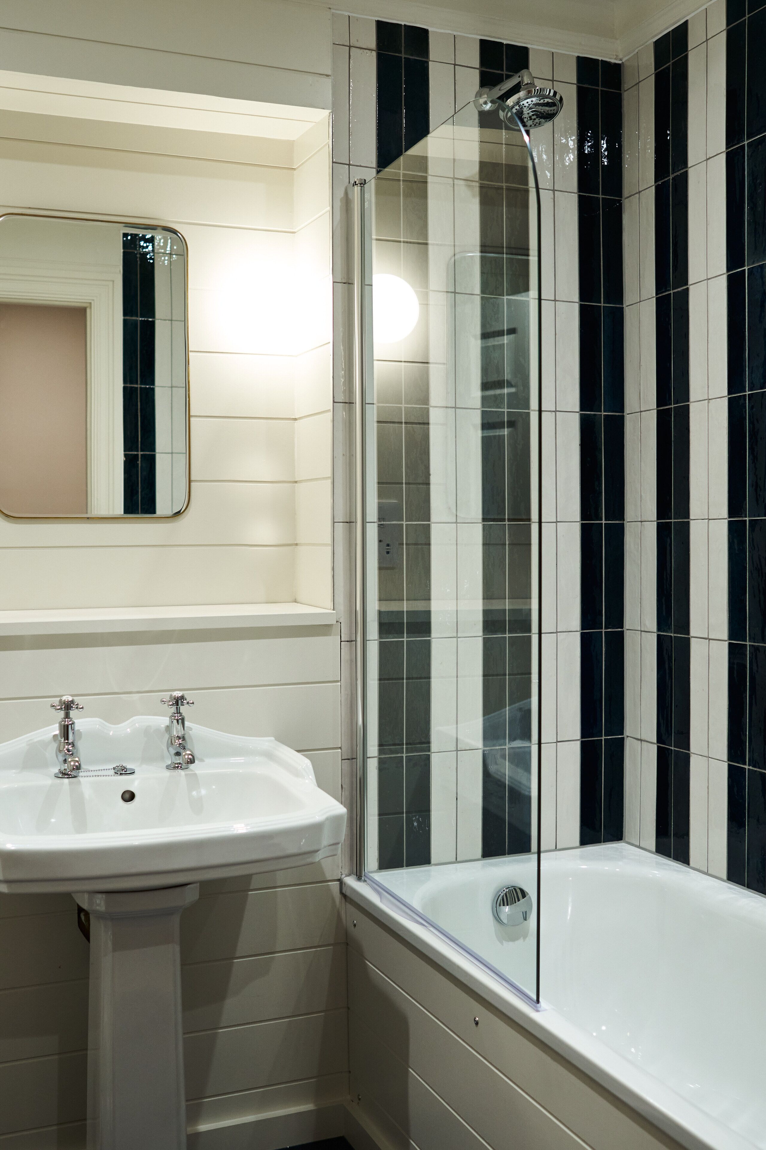 separate bathtub and shower, deep-soaking bathtub, rainfall showerhead