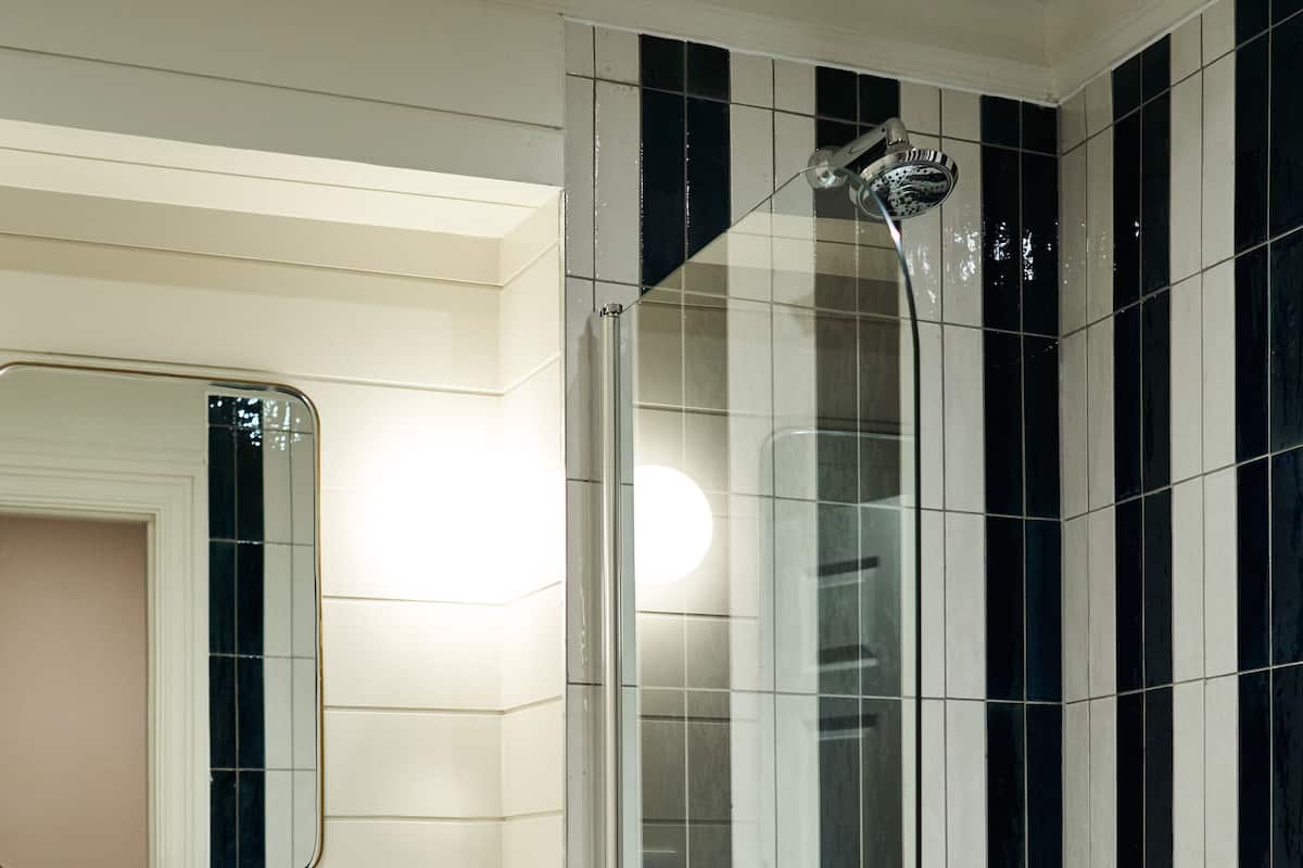 separate bathtub and shower, deep-soaking bathtub, rainfall showerhead